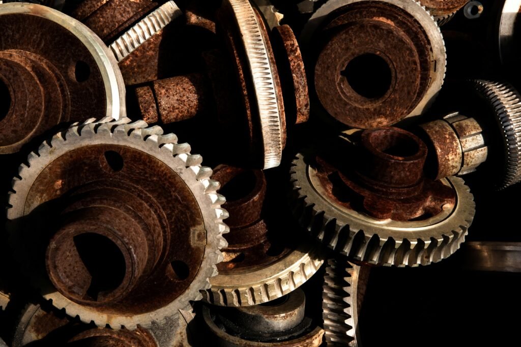 A detailed close-up of rusty industrial gears highlighting textured metal surfaces and intricate design.